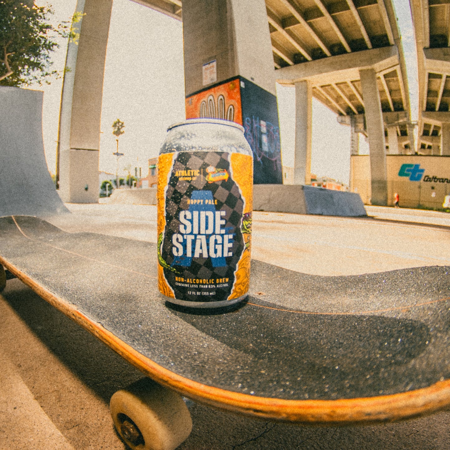 a side stage can beer on a skateboard