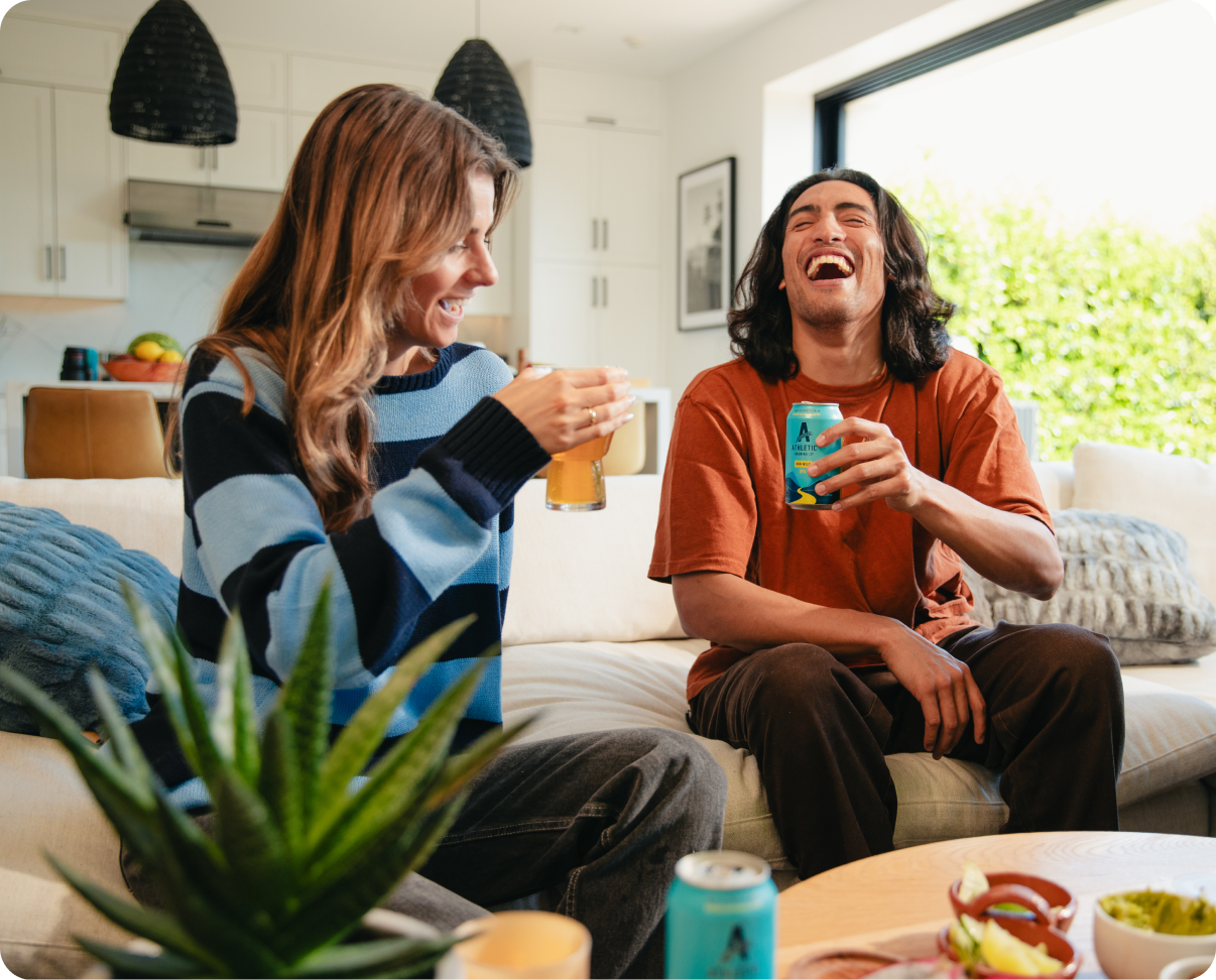 people enjoying brews on couch