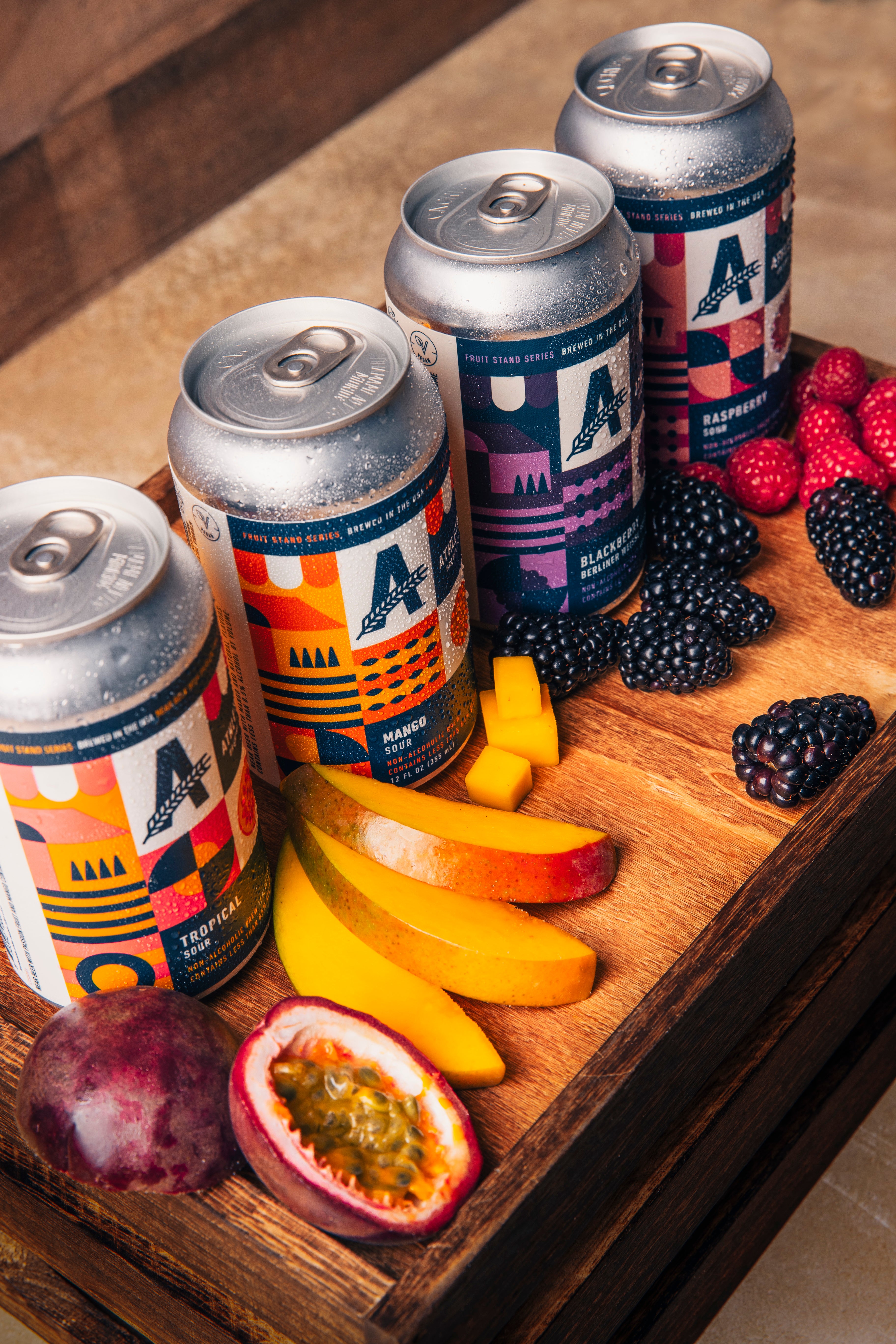4 cans and fruit on wood block