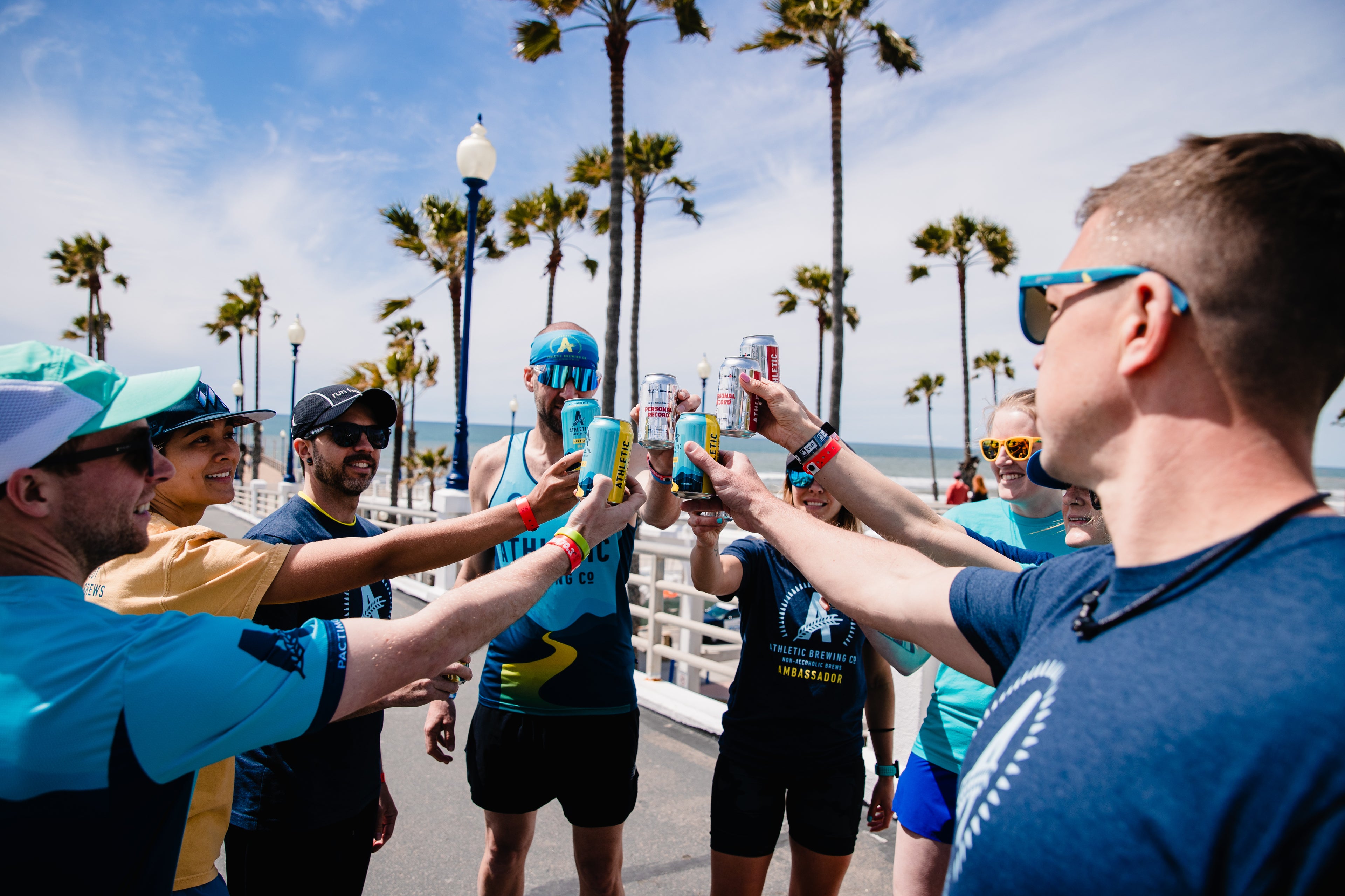 team cheering with brews outside