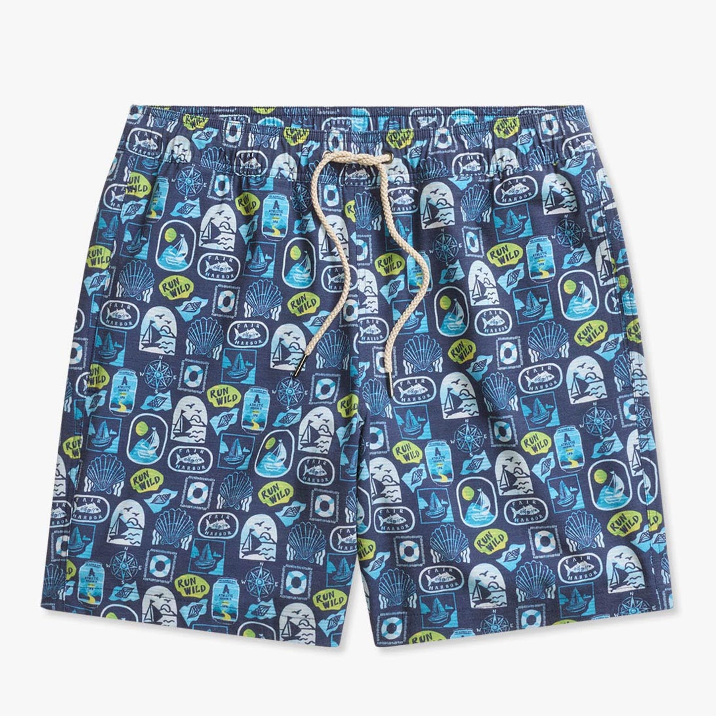 Navy blue swim shorts with an allover coastal-themed print featuring sailboats, seashells, waves, compass designs, Fair Harbor logos, and ‘Run Wild’ graphics in shades of blue, white, and lime green. The shorts have an elastic waistband with a beige drawstring and are shown against a light gray background.
