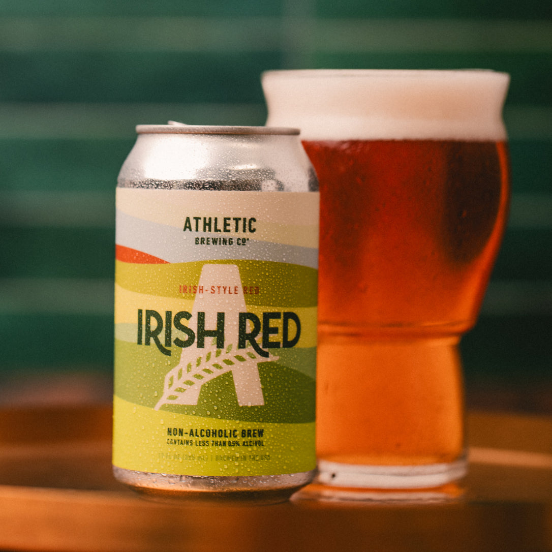 Close-up of Irish Red can next to a beer glass.