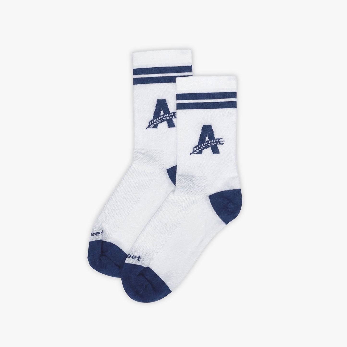 Pair of white Athletic Brewing crew performance socks with navy toe and heel accents, striped cuffs, breathable mesh knit panels, and large “A” logo branding on the ankle.