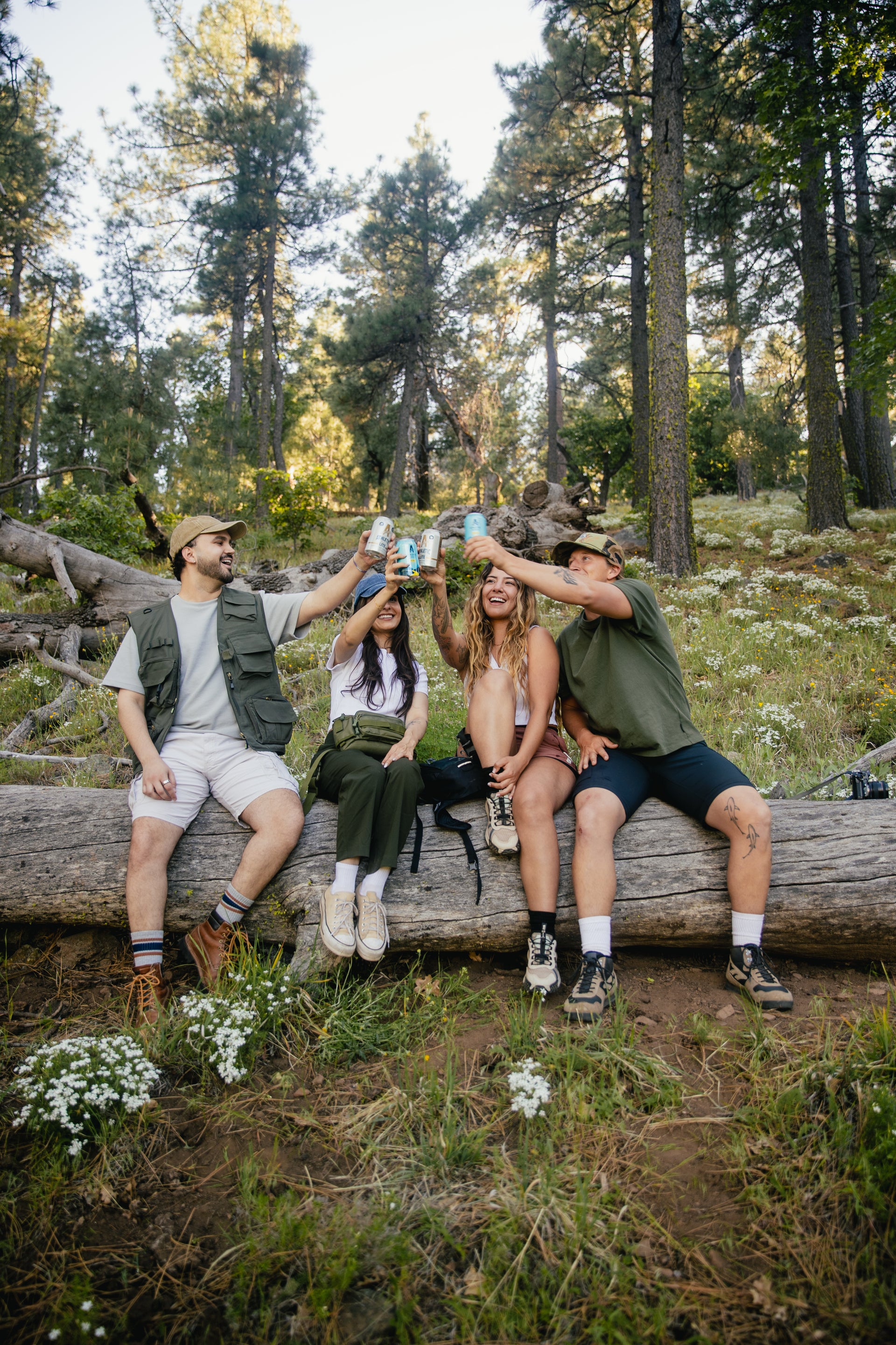 friends cheering brews in nature