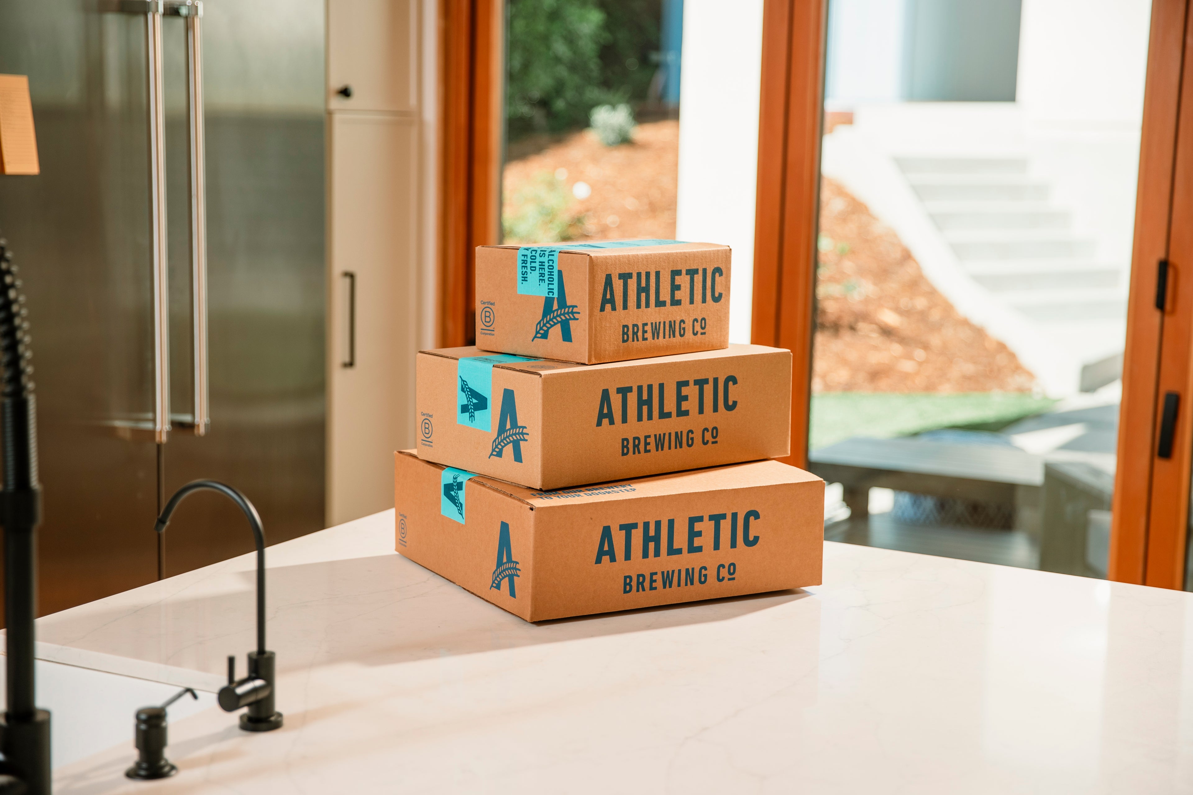 3 shipping boxes on a counter