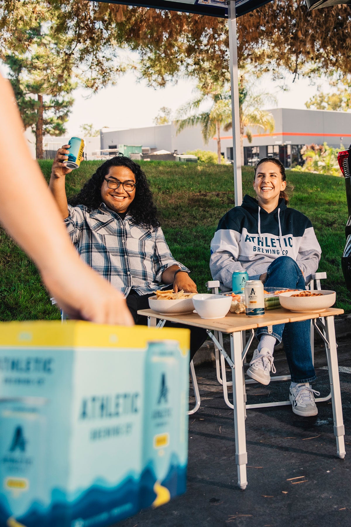 tailgating scene with people and NA beer