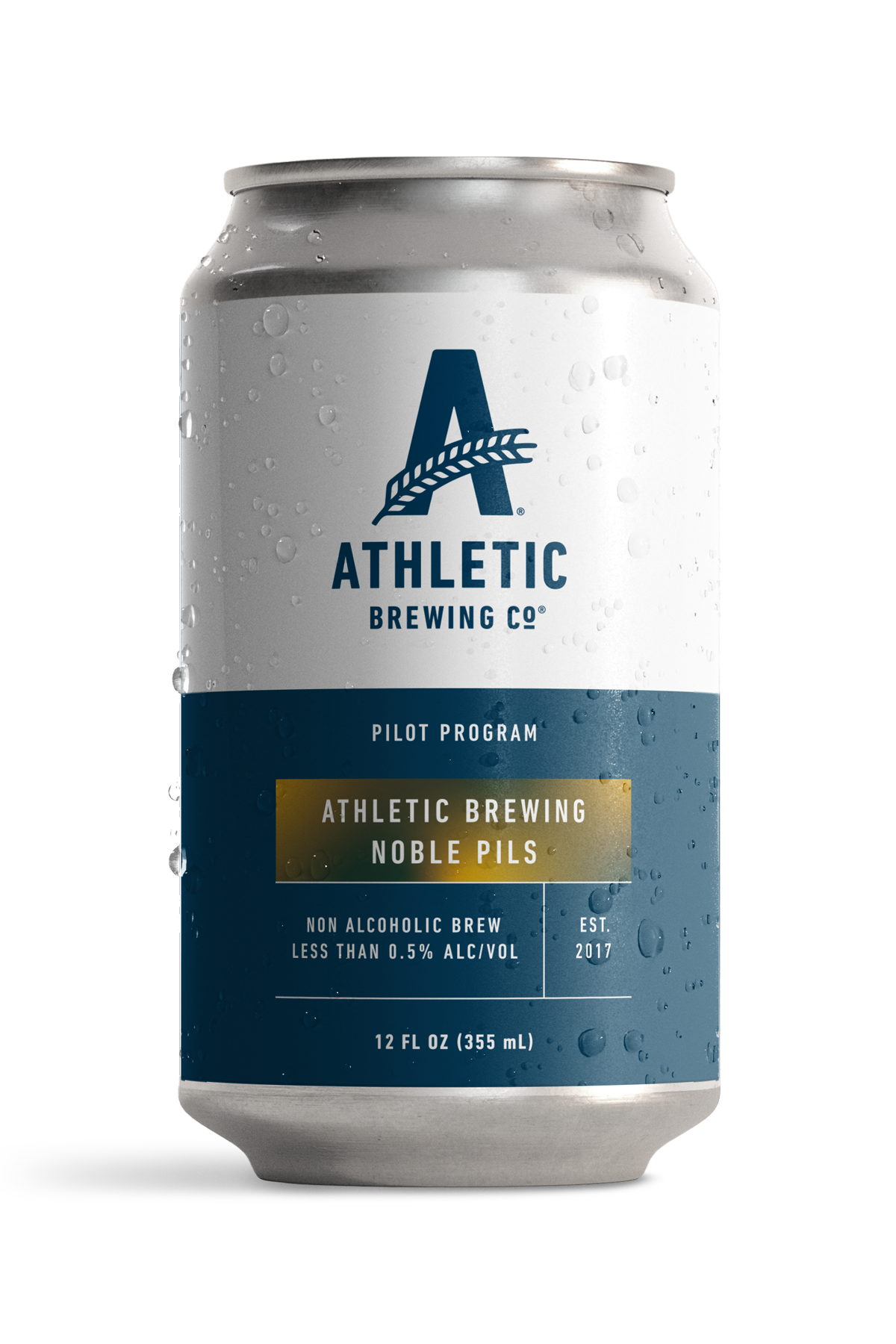 12 fl oz can of Athletic Brewing Pilot Program Noble Pils non-alcoholic beer. The silver can features a white upper label with the Athletic Brewing Co. logo and a navy blue lower label with gold accents displaying the beer name, “Noble Pils.” Additional text notes it is a non-alcoholic brew with less than 0.5% ABV. Condensation droplets cover the can, shown against a black background.