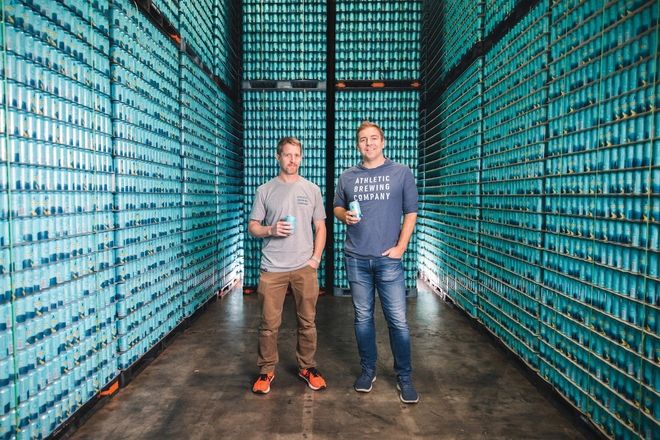 Bill and John surrounded by stacks of NA beer