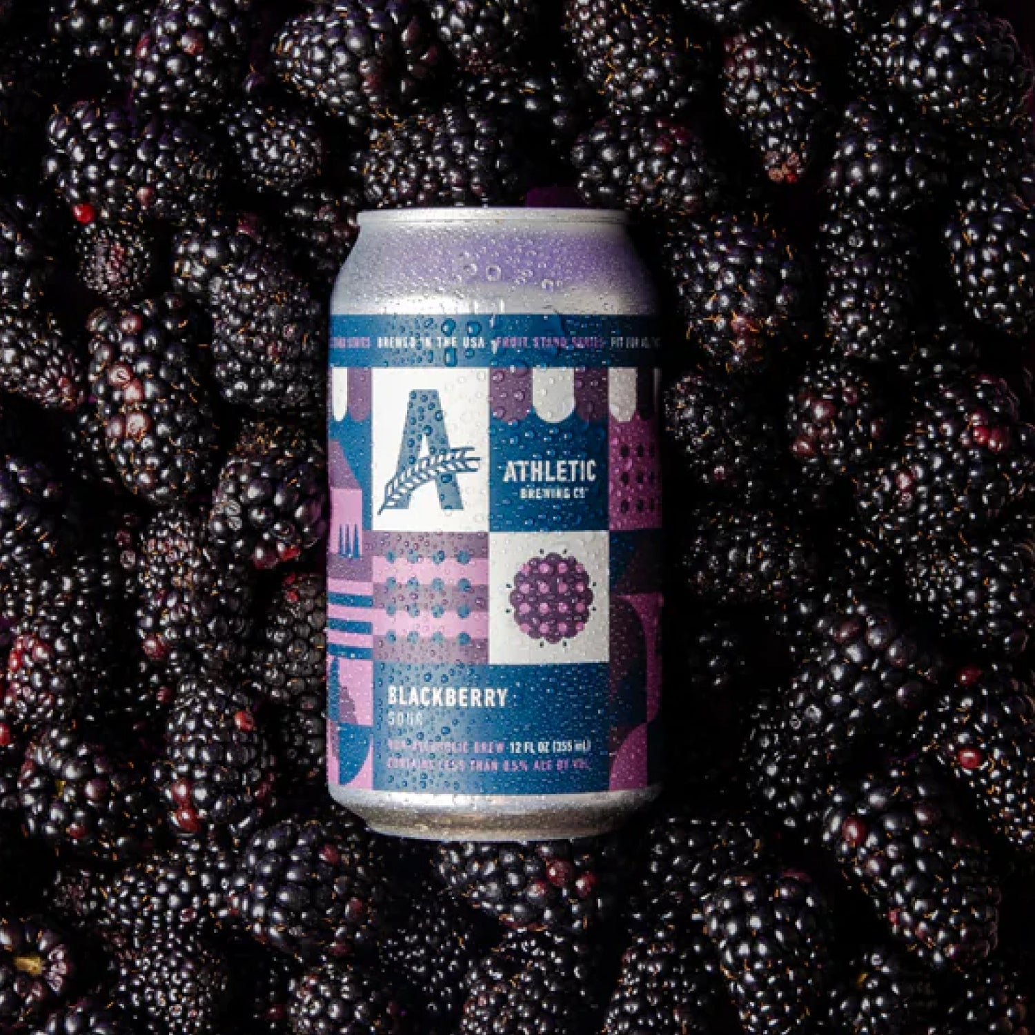 NA beer can with blackberry theme on a background of blackberries