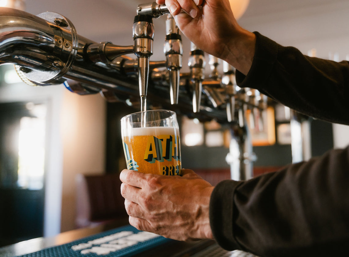draft pouring of Athletic NA beer