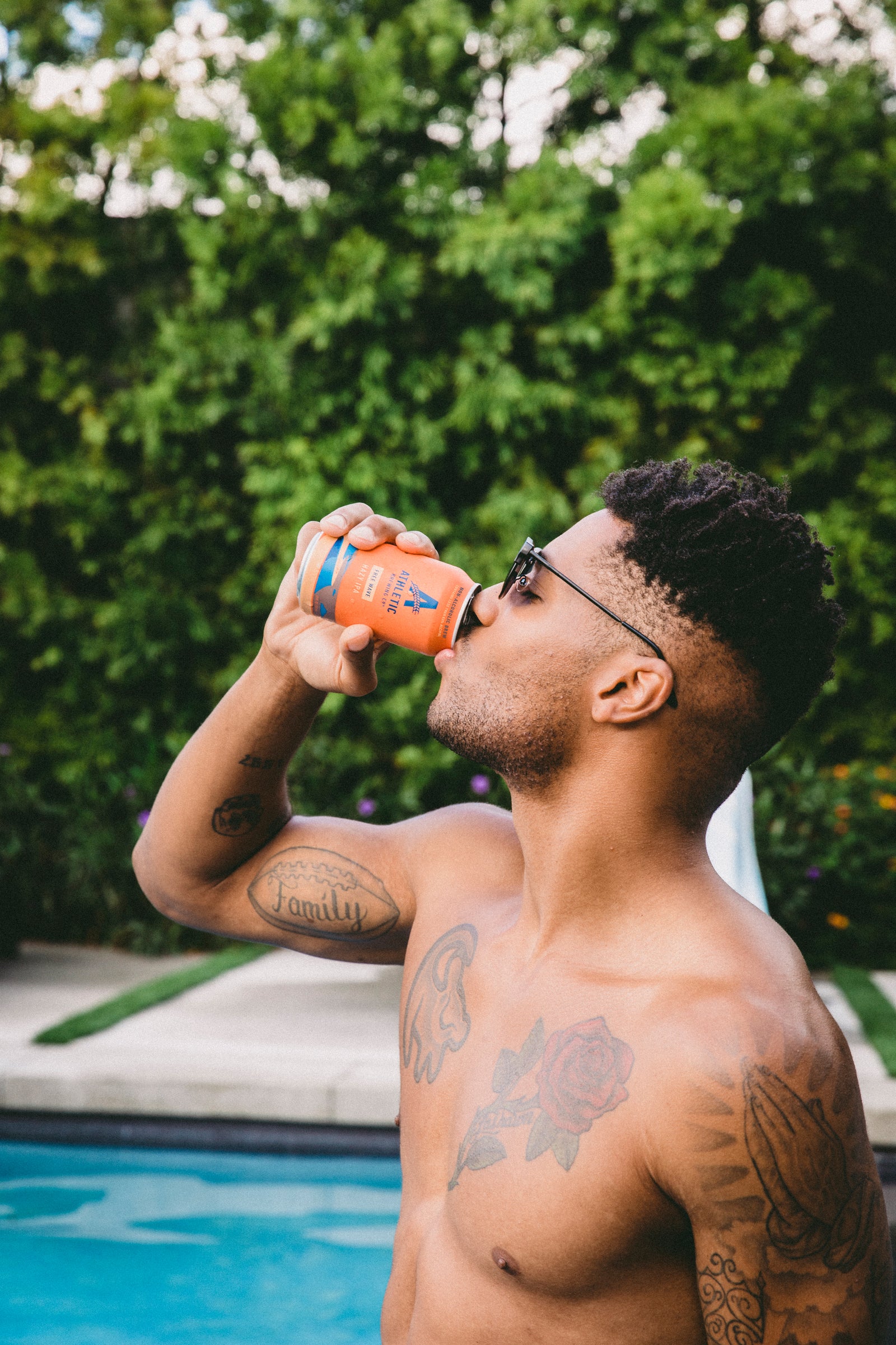 Man drinking a can of Free Wave