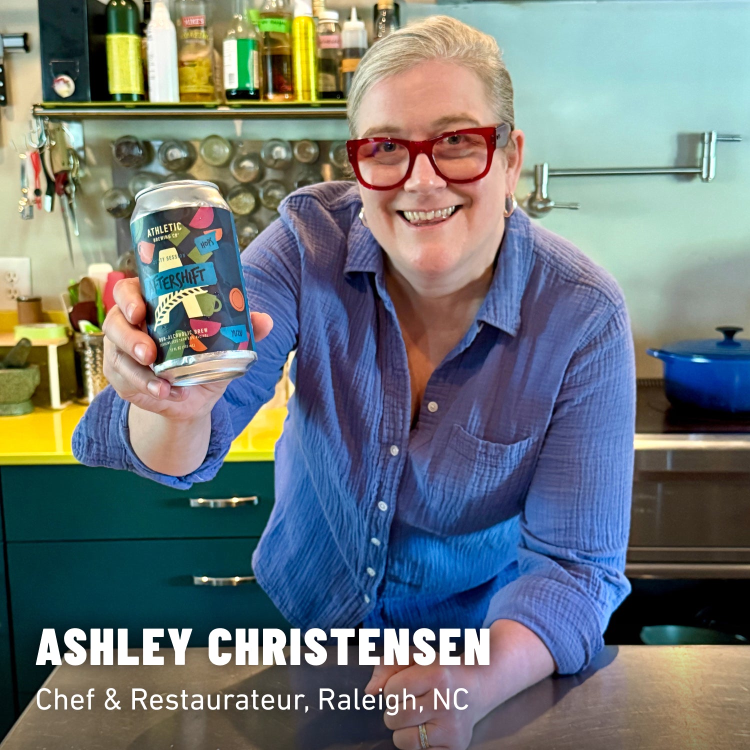 Ashley Christensen holding a can of non-alcoholic beer