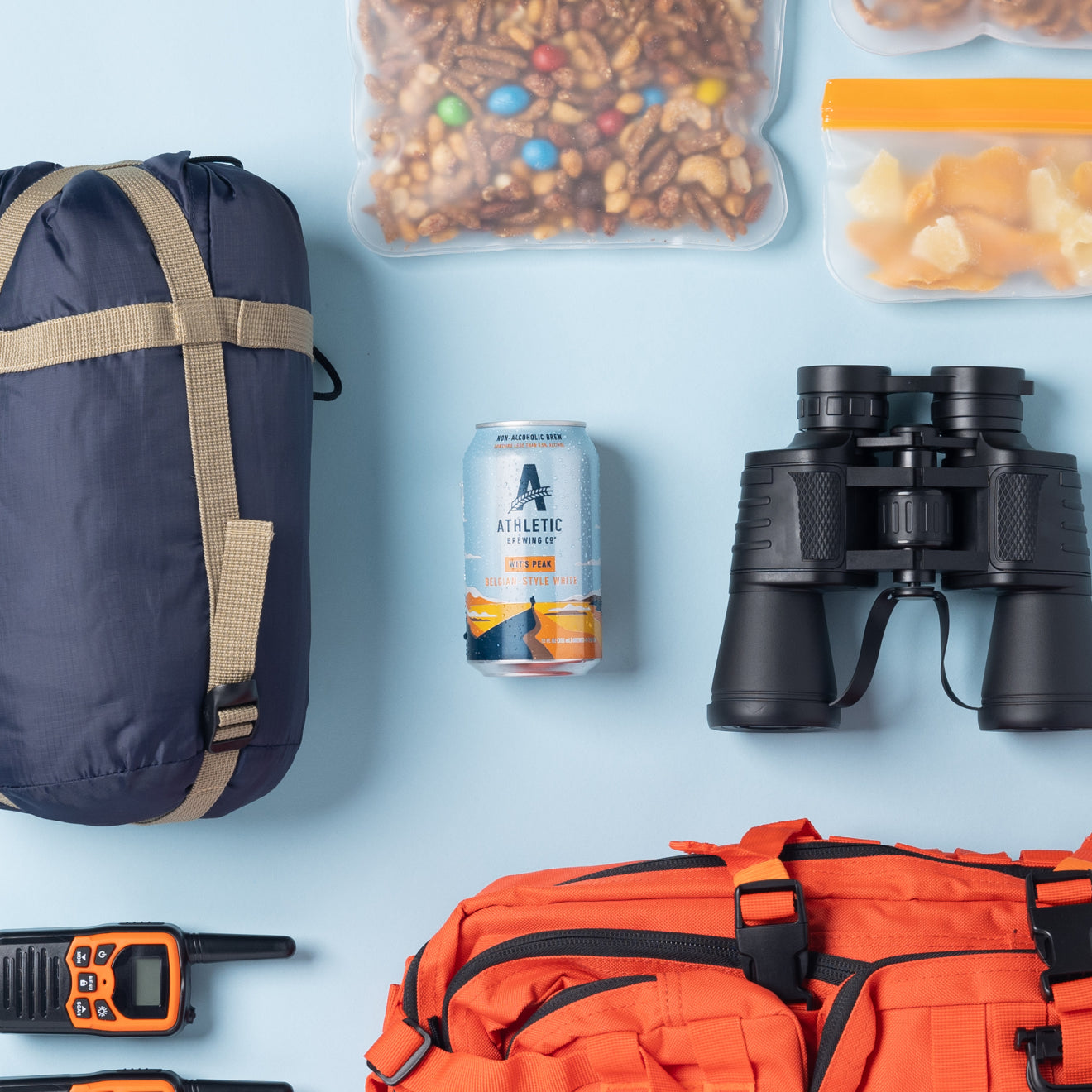 can of Wit's Peak surrounded by hiking gear and supplies