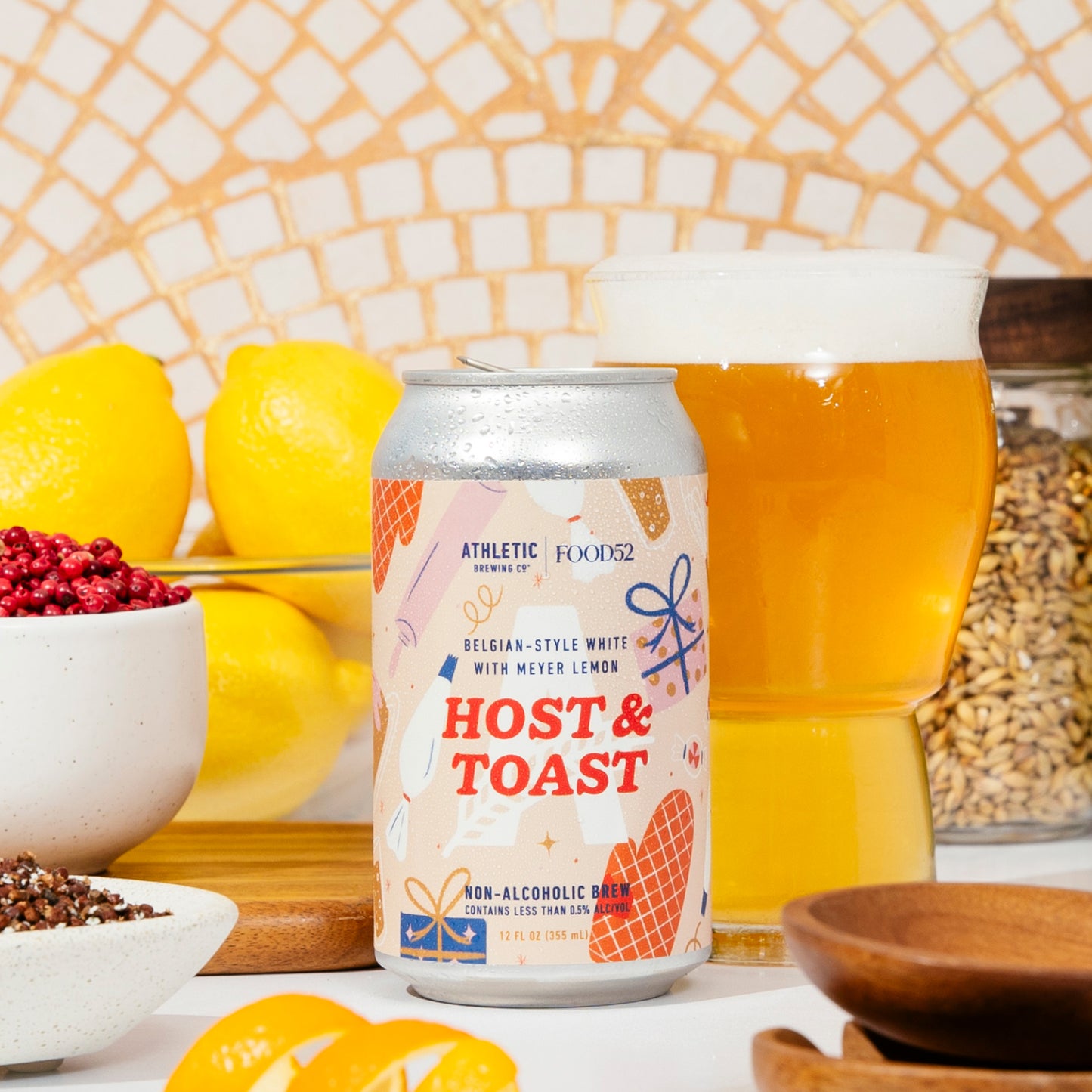 Host and Toast can and glass on countertop surrounded by ingredients