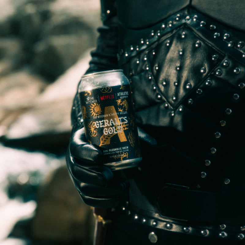 Geralt holding non-alcoholic beer can