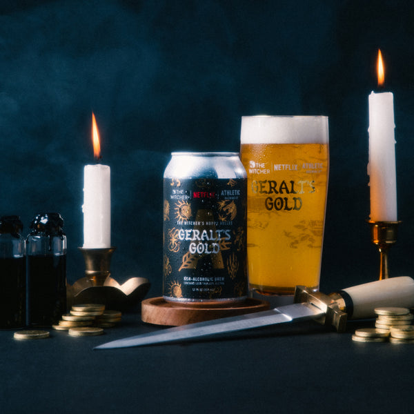 Geralt's Gold can and glass with candles