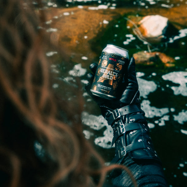 Geralt holding a can of Geralt's Gold brew