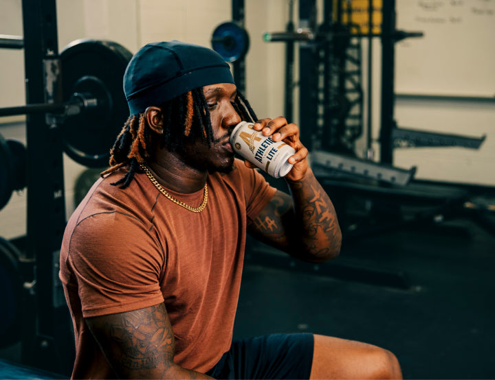 person drinking brew post-workout