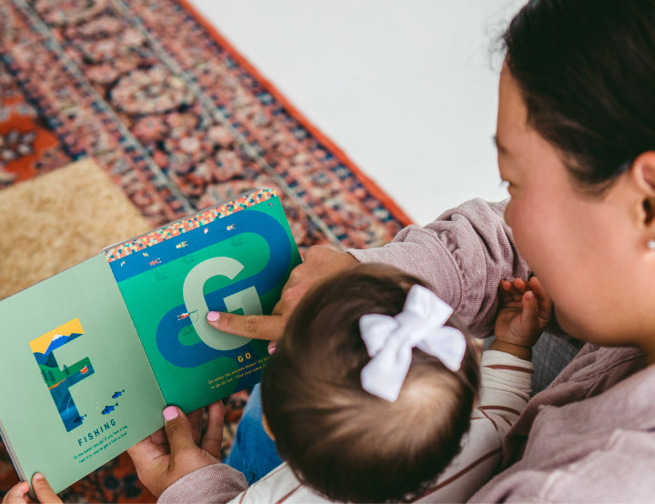 parent reading book to child