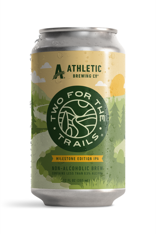 Condensation-covered can of Athletic Brewing Two for The Trails Milestone Edition IPA. The label features a stylized green forest landscape.
