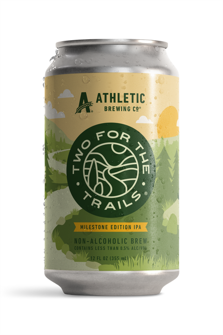 Condensation-covered can of Athletic Brewing Two for The Trails Milestone Edition IPA. The label features a stylized green forest landscape.
