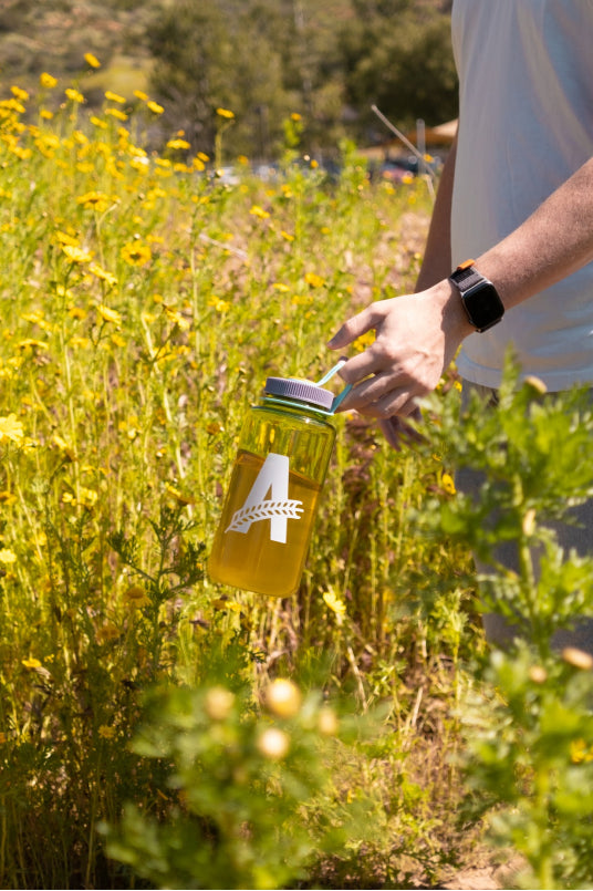 Merch water bottle in field