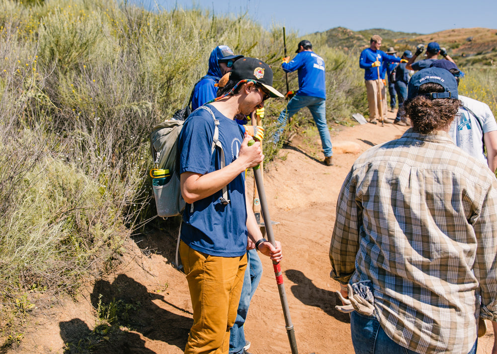 team working on a trail