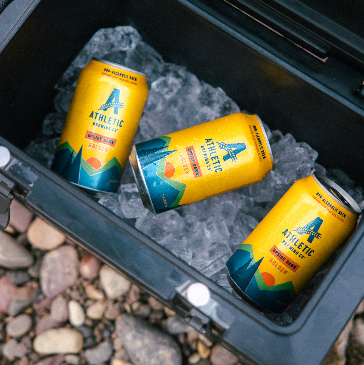 3 cans of upside dawn in a cooler on ice